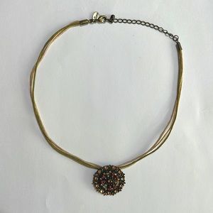 Round Pendant Multi-Color Brilliant Stones Gold Cord
Strand